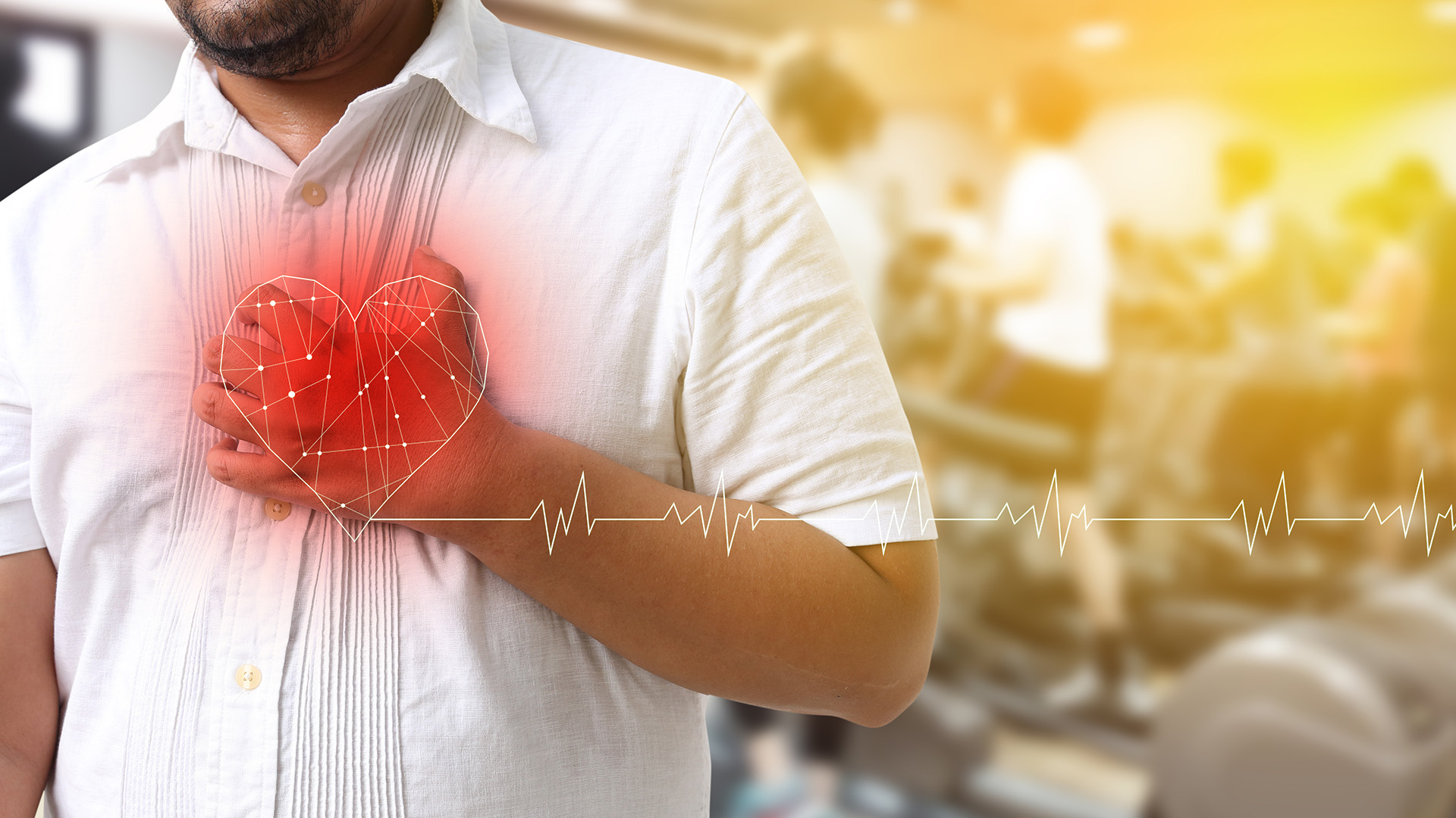 A man with his hand on his chest, appearing to be experiencing discomfort or pain, with a heart monitor graphic overlaying the image.